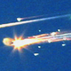 ** FILE **Debris from the space shuttle Columbia streaks across the sky over Tyler, Texas, in this Saturday, Feb. 1, 2003 file photo. Pices of the shuttle were scattered over East Texas with some debris falling in downtown Nacogdoches, Texas. Columbia disintegrated 39 miles over Texas as it returned from a 16-day mission five years ago this Friday, Feb. 1, 2008.